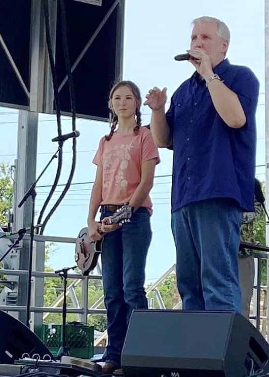 Emma M gets her new mandolin on stage at Wylie Jubilee 2025