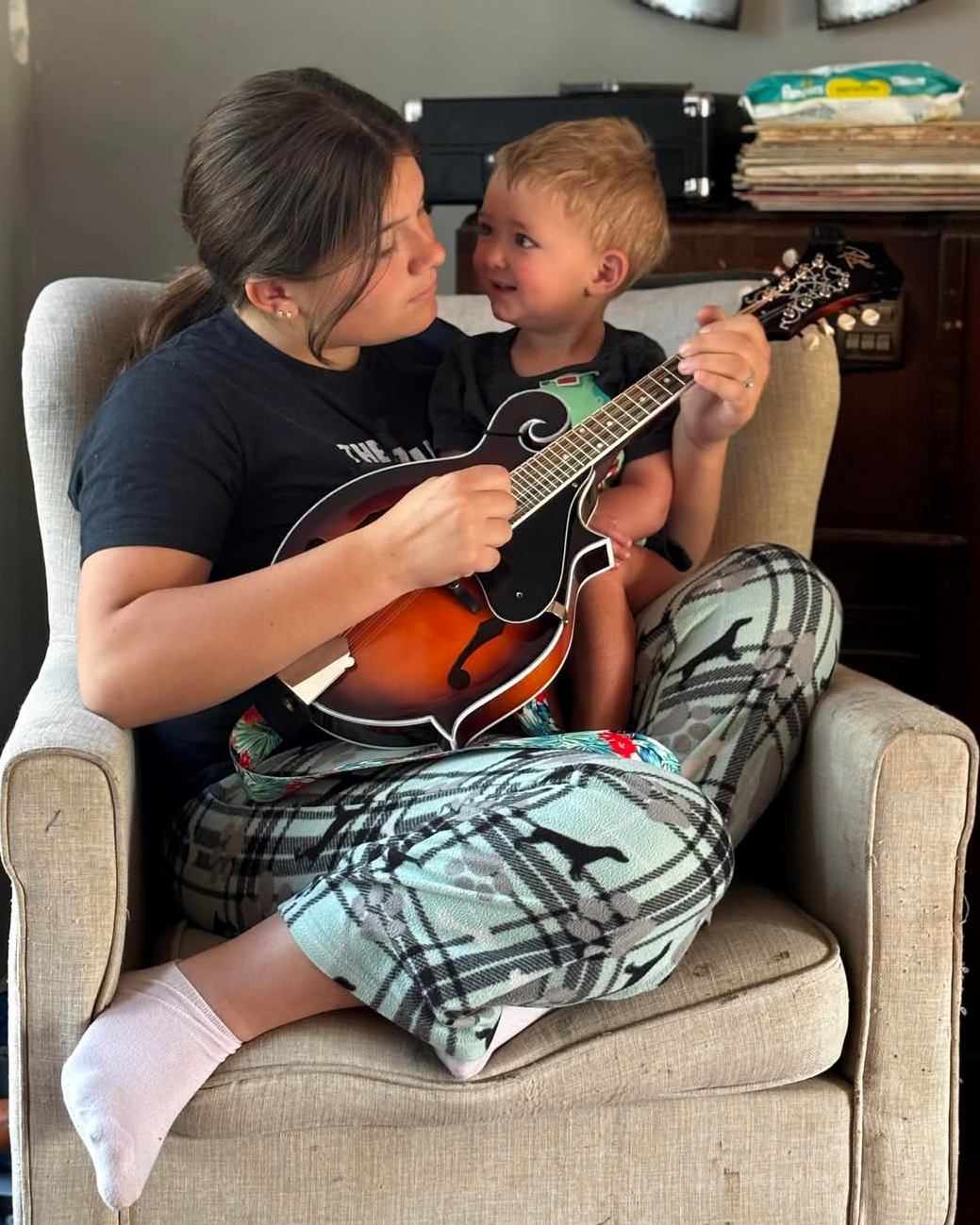 One of our Play it Forward! recipients practices while little brother looks on!