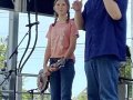 Emma M gets her new mandolin on stage at Wylie Jubilee 2025