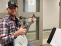 Ky School of Bluegrass banjo student with PIF banjo (Feb 2023)