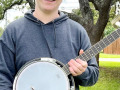 Parker J with his Play It Forward! banjo (Apr 2023)