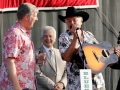 Presentation of the Bluegrass Star Award by Alan Tompkins to Del McCoury, with Peter Rowan. Photo by Nathanial Dalzell.