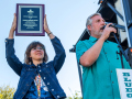 Jessica Tompkins displays the IBMA Distinguished Achievement Award at Bloomin Bluegrass 2024 (by Nate Dalzell)