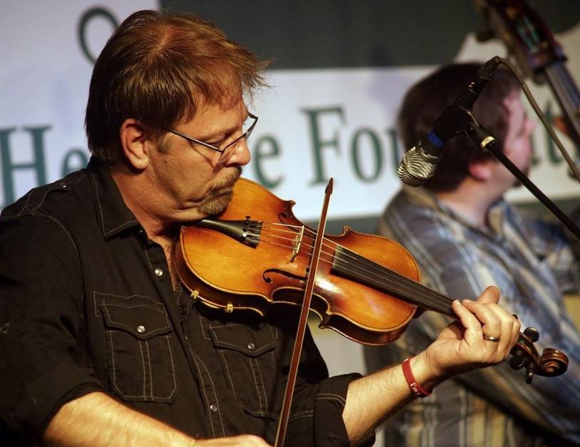 Ron Stewart fiddling with the Boxcars at Lone Star Fest 2015. Photo by Bob Compere.