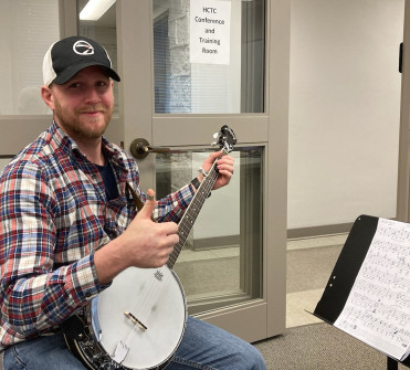 Ky School of Bluegrass banjo student with PIF banjo (Feb 2023)