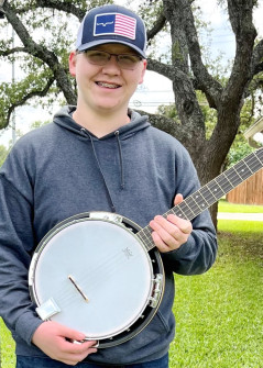 Parker J with his Play It Forward! banjo (Apr 2023)