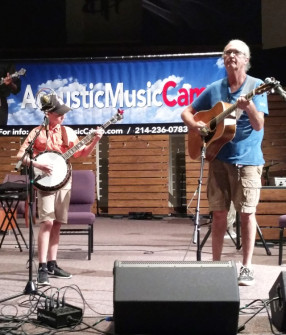 Riley Gilbreath & Jim Penson on stage at Acoustic Music Camp 2017