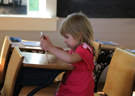 Jessica Lynn studies in the historical schoolhouse at Bloomin' Bluegrass 2013. Photo courtesy of Derrick Birdsall.