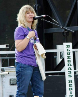 Guest M/C Julie Tompkins at Bloomin' Bluegrass Festival 2015. Photo by Bob Compere