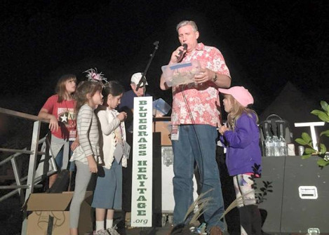 Raffle time for some excited young ladies at Bloomin' Bluegrass Festival 2015. Photo by Derrick Birdsall.